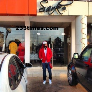 Sarkodie infront of the 'Sark Shop'