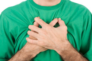 Both man's hands on breast because of hard breathing