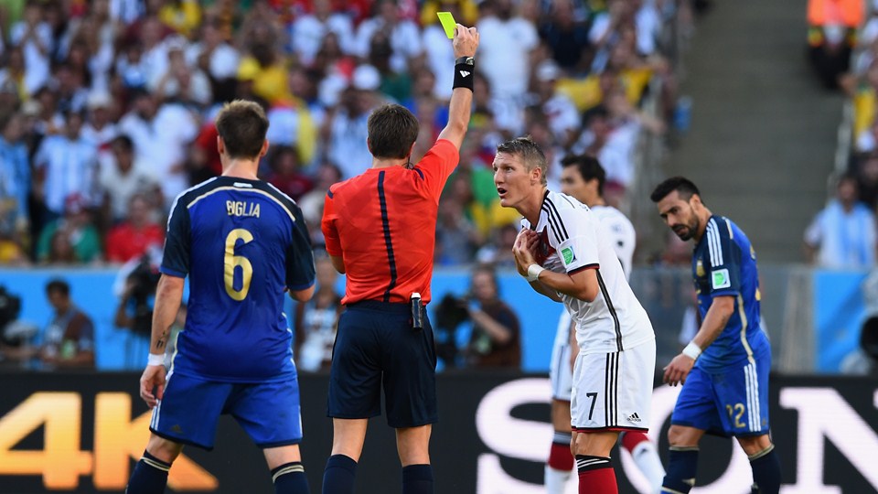 Bastian-Schweinsteiger-of-Germany-is-shown-a-yellow-card