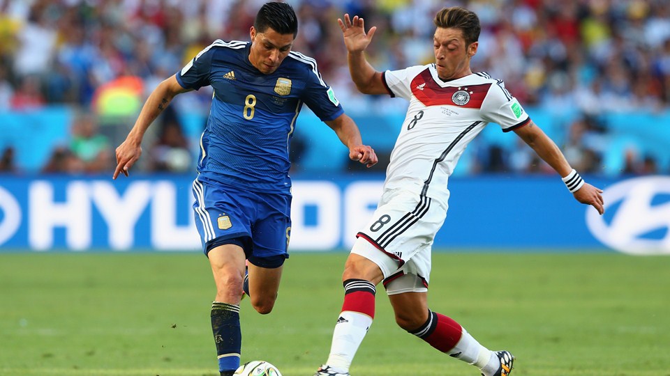 Enzo-Perez-of-Argentina-is-challenged-by-Mesut-Oezil-of-Germany