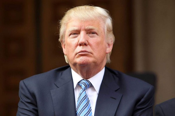 WASHINGTON, DC - JULY 23:  Donald Trump listens at the Trump International Hotel Washington, D.C Groundbreaking Ceremony at Old Post Office on July 23, 2014 in Washington, DC.  (Photo by Paul Morigi/WireImage)