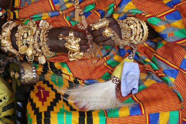 A traditional chief wears Kente cloth and gold ornate jewellery on his body at celebrations to mark the 10th anniversary of the enstoolment of the Asantehene Otumfuo Nana Osei Tutu II in Kumasi.